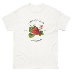 Fresh finds, Farmer's Market, strawberry T-Shirt, oversized shirt 🍓🌸 The 100% cotton men's size classic tee will help you land a more structured look. It sits nicely, maintains sharp lines around the edges, and goes perfectly with layered streetwear outfits. Plus, it's extra trendy now!   * 100% cotton  * Sport Grey is 90% cotton, 10% polyester  * Ash Grey is 99% cotton, 1% polyester  * Heather colors are 50% cotton, 50% polyester  * Fabric weight: 5.0-5.3 oz/yd² (170-180 g/m²)   * Open-end ya Strawberry T Shirt, White Graphic Tee, Layered Streetwear, Farmer's Market, T Shirt Oversized, Streetwear Outfits, Look Plus, Ash Grey, Oversized Shirt