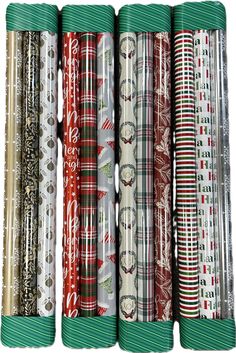 six rolls of christmas wrapping paper lined up on top of each other in different patterns