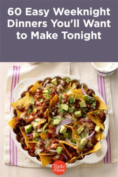 a white plate topped with nachos and salsa