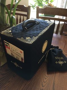 a black box sitting on top of a wooden table