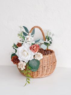 a basket filled with flowers sitting on top of a table