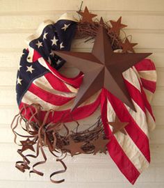 an american flag wreath hanging on the wall