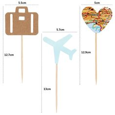 the size of two toothpicks with an airplane on them and a map in the shape of a heart