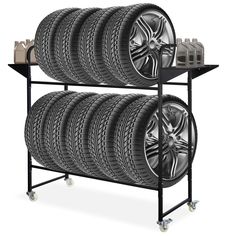 four tires are stacked on top of each other with wheels attached to the bottom shelf