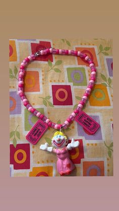 kandi necklace with vintage clown figure and ticket charms. Handmade by me. Clowncore Jewelry, Clown Inspired Necklaces, Clown Earrings, Clown Necklace, Clown Frilly Collar, Clown Trinket, Kandi Necklace, Vintage Clown, Lonely Heart