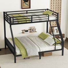 a black metal bunk bed with green and white pillows on it's bottom shelf