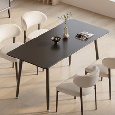 a black table with white chairs around it