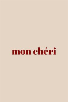 the word mon cher written in red on a beige background