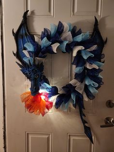 a dragon wreath is hanging on the front door