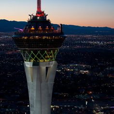 an aerial view of the las vegas strip at night, with lights on and around the tower