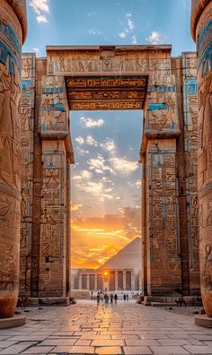 the entrance to an egyptian temple at sunset