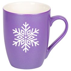 a purple coffee cup with white snowflakes on it