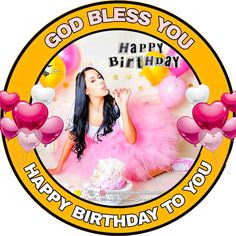 a woman sitting in front of a birthday cake with balloons around her and the words happy birthday to you written on it