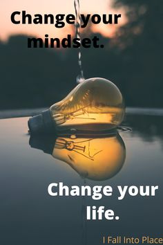 a light bulb hanging from the side of a car with text that reads, change your minds