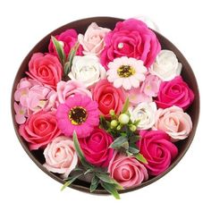 a bowl filled with pink and white flowers