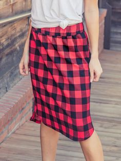 Looking for a weekend skirt that's both cozy and stylish? Look no further than our Buffalo Plaid Weekend Skirt! This skirt is the perfect combination of cute and comfortable, with a knee-length cut and a self-tie waistband that'll keep you feeling feminine and put-together all day long. Whether you're running errands or meeting up with friends for brunch, this skirt is sure to turn heads. And with sizing options ranging from S to 3X, it's easy to find the perfect fit for your body type.So why wa Fall Daywear Skirted Bottoms, Casual Winter Midi Pencil Skirt, Fall Mini Skirt With Elastic Waistband, Midi Skirt For Daywear In Fall, Casual Fall Mini Pencil Skirt, Casual Fall Midi Skirt, Casual Midi Skirt For Fall, Casual Pencil Mini Skirt For Fall, Casual Mini Pencil Skirt For Winter