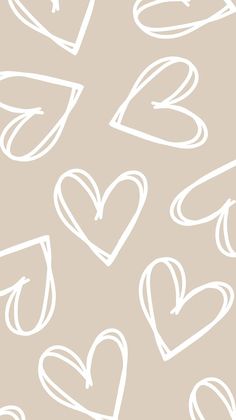 hearts drawn in white on a beige background