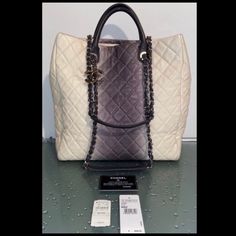 Authentic Chanel Rare Ombre Large Quilted Ivory Gray Silver Chain Tote Handbag. Originally Purchased In Neiman Marcus Boca Raton, Florida $3,600; Comes With Original Price Tags & Authenticity Card Matching The Inside Hologram; Condition Is "Excellent Pre-Owned"; Very Clean With Only Light Signs Of Preloved; Handles Look Brand New From A Nonsmoking Home Luxury White Bags With Chain Strap, Luxury Gray Shoulder Bag, Gray Luxury Shoulder Bag For Evening, Luxury Gray Evening Bag, Chanel Cerf Tote, Chanel Grand Shopping Tote, Chanel Canvas, La Girls, Chanel Tote Bag