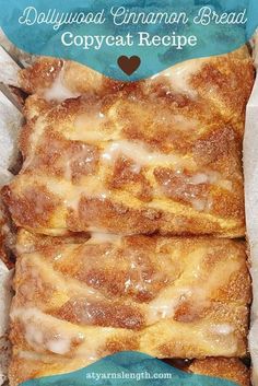 two pieces of cinnamon bread with icing on top in a cardboard box next to the words, dollywood cinnamon bread copycat recipe