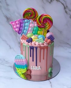 there is a cake decorated with candies and lollipops