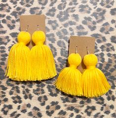 These stylish Tassel Earrings are the perfect accessory for any outfit. Made from high quality materials, these earrings are both durable and lightweight. With their elegant design and colorful tassels, they add a fun and playful touch to your look. Whether you're dressing up for a special occasion or just adding some flair to your everyday outfit, these earrings are sure to impress. Key Features: - High quality materials - Lightweight design - Elegant and colorful tassels - Perfect accessory fo Yellow Fringe Tassel Earrings, Elegant Yellow Fringe Earrings, Trendy Tassel Earrings, Yellow Handmade Tassel Earrings, Yellow Fringe Tassel Drop Earrings, Yellow Fringe Earrings As Gift, Adjustable Beaded Tassel Earrings, Trendy Fringe Earrings As A Gift, Elegant Yellow Tassel Earrings