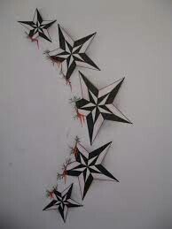 some black and white stars are hanging on the wall