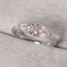 ◆ The ring is handcrafted from sterling silver and decorated with a dazzling 7*5 mm natural pink quartz and 6*4 mm CZ. It is suitable for engagement/anniversary/daily occasion. ◆ Production Description: Main stone Type: Natural pink quartz and CZ Main Stone Shape: Pear Cut Main Stone Size: 7x5 mm(0.73 ct) and 6x4 mm(0.65 ct) Side stone: None Metal: 925 Sterling silver - Other options available in the drop down menu ◆ Customization: √Free for Add Engraving √Other Metal Type Available √Other Gemst Promise Rings Rose Quartz, Rose Quartz Wedding Ring Silver, Rose Quartz Princess Cut Ring, Quartz Wedding Ring, Rose Quartz Rings Silver, Silver Heart-shaped Rose Quartz Jewelry, Wedding Ring For Women, Rose Quartz Ring, Engagement Anniversary