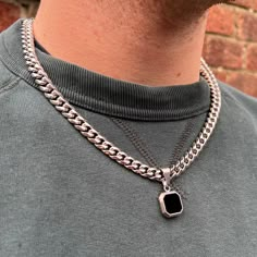 Silver Onyx styled Pendant on an 8mm Cuban Link.  We have added it to an 8mm Cuban link chain with an extra large bail for a brutalist style. Made using black enamel & recycled stainless steel. We do have the option for the onyx version to be purchased but the black enamel is better suited for this piece since the gem cannot fall out. Available in 18K Gold or Silver.  DETAILS Chain style: Curb (8mm) Materials: Stainless Steel & 18K Gold PVD Plating Twistedpendant Logo engraved on the Rear of the Mens Chain Necklace Silver, Black Chain Necklace Men, Mens Chains Silver Men Necklace, Male Silver Chain Necklace, Men's Scarves, Necklaces For Men, Black Onyx Pendant, Luxury Jewelry Box, Mens Necklace Pendant