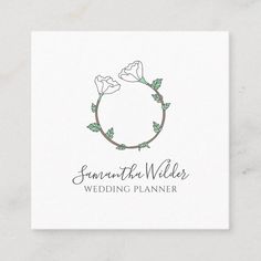 the logo for a wedding planner is shown on a white card with green leaves and flowers