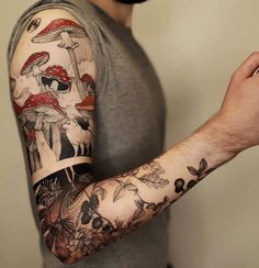 a man with a mushroom tattoo on his arm