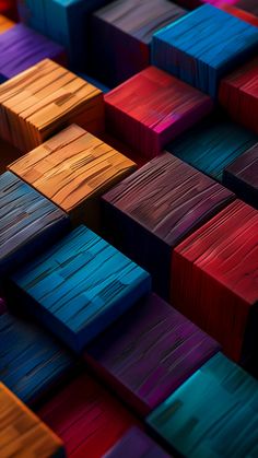 many different colored wooden blocks are arranged in the shape of an abstract pattern, including red, blue, yellow and green