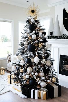 a black and white christmas tree decorated with ornaments