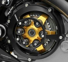 the front wheel of a motorcycle that is yellow and black