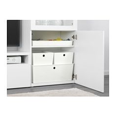 a white entertainment center with two storage bins