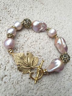 Bracelet with big baroque and edison freshwater pearls with antique gold toggle clasp and beads. 18cm Bracelet Ideas Gold, Pearl Ideas, Awareness Jewelry, Edison Pearls, Bracelets Design, Pearl Bracelets, Design Bracelet, Beads Bracelet Design, Handmade Jewelry Tutorials