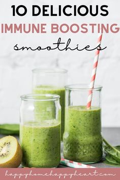 two jars filled with green smoothie next to an orange slice