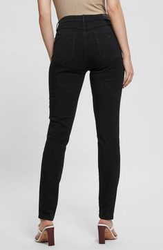 An on-trend high waist and solid-black wash maximize the chic style of these shapely skinny jeans cut in an ankle-gazing length. 29" inseam; 10" leg opening; 10 1/4" front rise; 14 1/2" back rise Zip fly with button closure Five-pocket style 40% Tencel® lyocell, 36% cotton, 14% Tencel® modal, 10% elastane Tencel lyocell is a more-sustainably produced fiber made with closed-loop processing Tencel modal is a more-sustainably produced fiber made with closed-loop processing and is certified with the Tight Black Straight Leg Jeans, Chic Black Straight Leg Jeggings, Black Tight Straight Leg Jeggings, Tight Black Straight Leg Jeggings, Black Straight Leg Jeggings, Black Mid-rise Jeggings For Spring, Black Straight Leg Jeggings For Fall, Black Fall Jeggings, Black Straight Leg Jeggings For Work