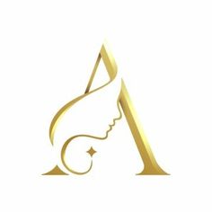 a woman's face with long hair in the shape of a golden letter logo