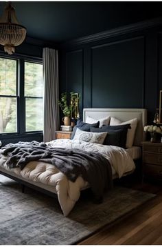 a bedroom with black walls, white bedding and gray carpeted area rugs