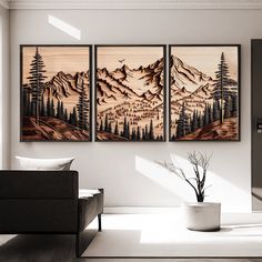 three paintings on the wall in a living room