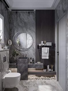 a modern bathroom with marble walls and flooring, including a round mirror on the wall