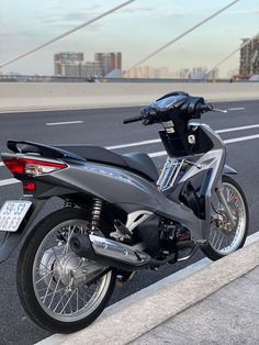 the motorcycle is parked on the side of the road