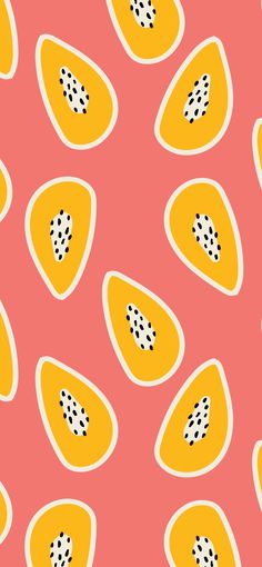 an orange and yellow fruit pattern on a pink background with polka dot dots in the center