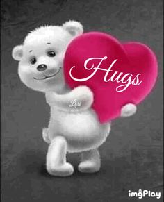 a white teddy bear holding a pink heart with the word hugs on it's chest