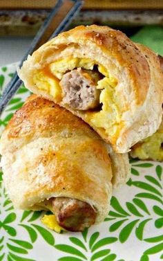 an egg and sausage breakfast roll on a plate