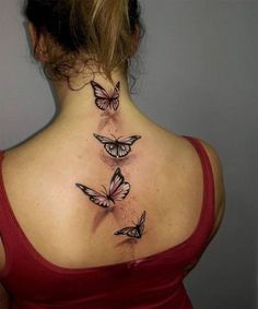 the back of a woman's neck with three butterflies on her upper and lower part