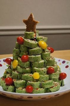 a christmas tree made out of cookies on a plate