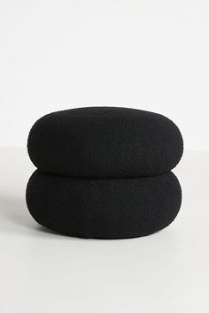 two black pillows stacked on top of each other