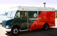 a food truck parked next to the water