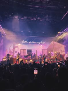 a group of people standing on top of a stage